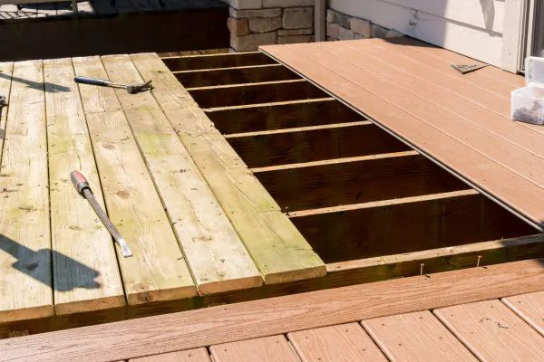 wooden deck boards being replaced with composite deck boards