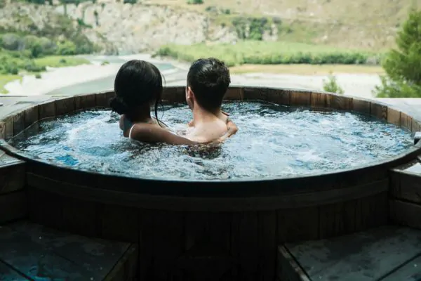 couple enjoying their hot tub on deck